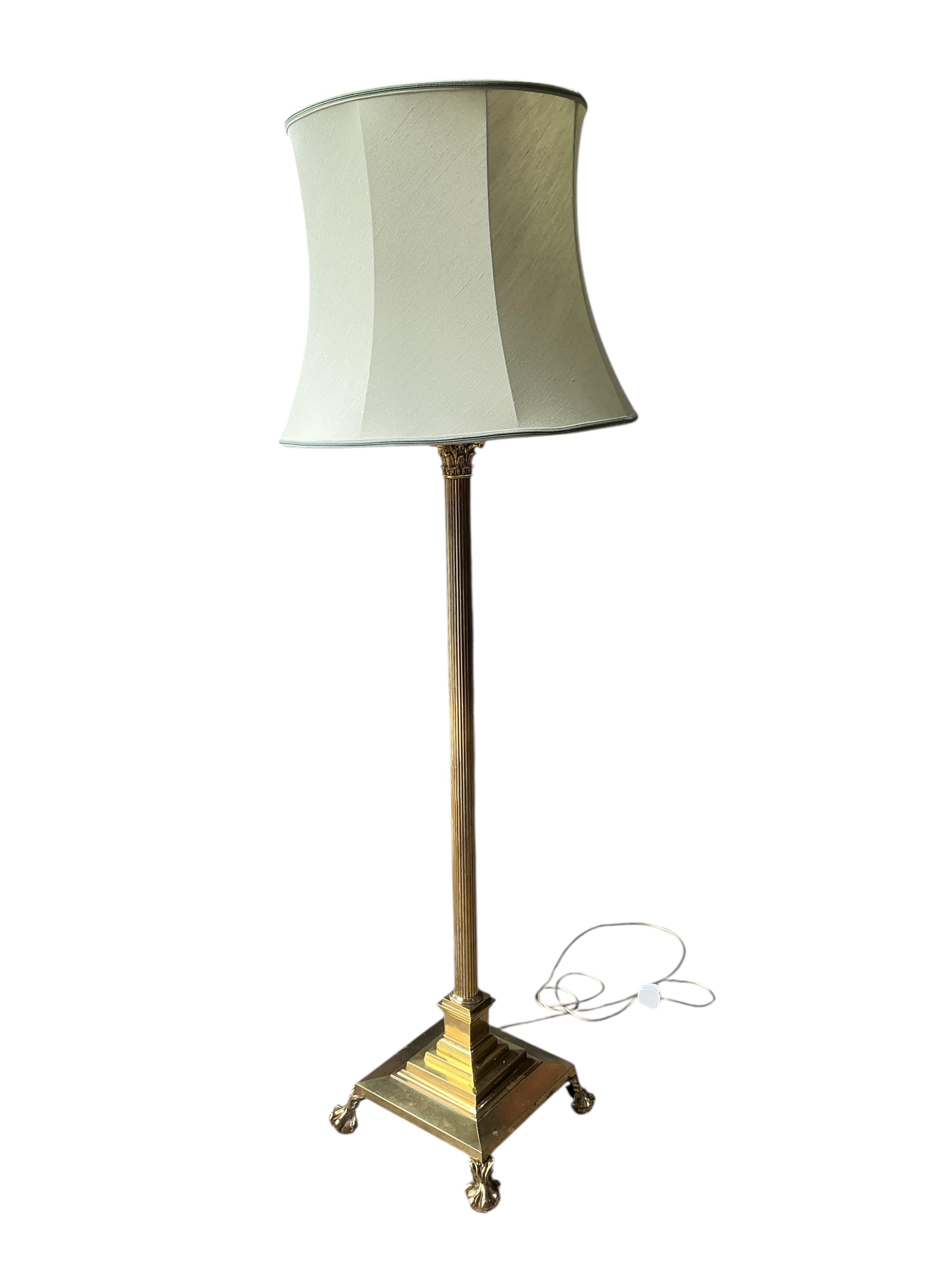 An Edwardian brass Corinthian column telescopic standard lamp